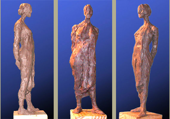 Impressionistic sculpture of a standing woman.