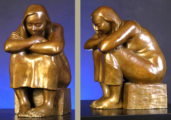 Sculpture of a seated woman in bronze