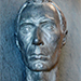 Thumbnail sculpture of a male head.