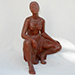 Thumbnail of a female seated sculpture.